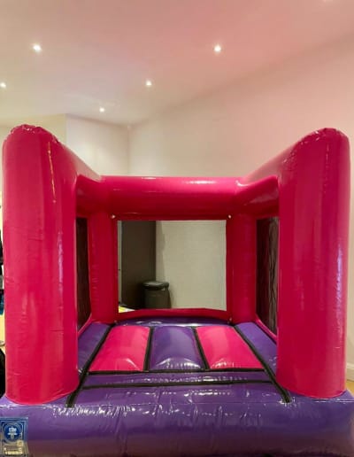 Pink Mini Bouncer, a toddler inflatable for hire from Bouncy Mania