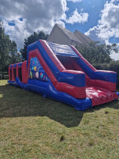 40ft Energy Assault Course - Blue & Red Party Theme, a assault course for hire from Airscape Events
