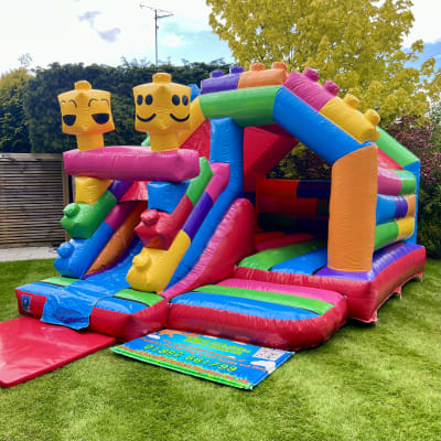 Lego Bounce and Slide, a bounce and slide combo for hire from KBS Inflatable Kingdom
