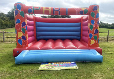 Adult Bouncy Castle Balloon themed 15ft x 15ft, a adult bouncy castle for hire from 1st Choice Inflatables
