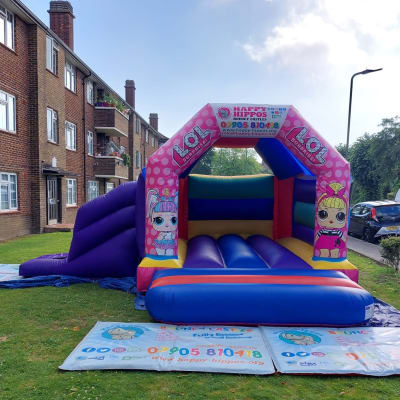 LOL Slide 15ft x 18ft - Purple & Red, a inflatable slide for hire from Happy Hippos Bouncy Castles