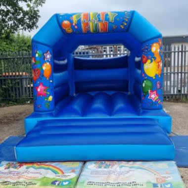 Party Fun Blue Castle, a bouncy castle for hire from Bounce About Sussex