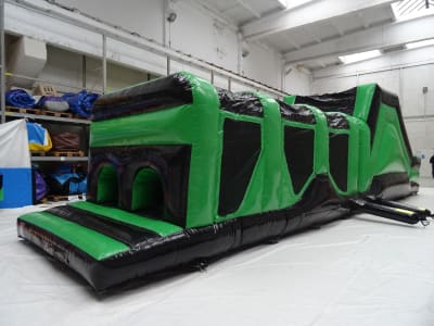 Green & Black Assault Course (42ft), a assault course for hire from Cookes Castles
