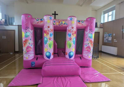 Pink Party Midi Castle INDOORS ONLY (10ft x 13ft), a bouncy castle for hire from Elmbridge Inflatables