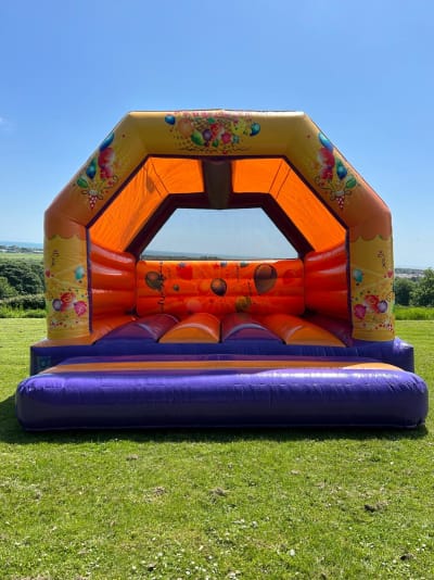 Adult Purple and Orange Party Castle, a adult bouncy castle for hire from Crockerz Castles