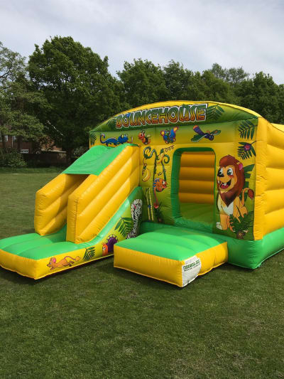 12ft x 18ft Jungle Slide Combi Bouncy Castle, a bounce and slide combo for hire from Rick's Castles