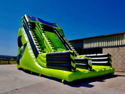 Adult 15ft Platform Toxic Mega Slide, a inflatable slide for hire from Animal Bouncers