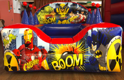 Superheroes Air Juggler Ball Pond, a soft play set for hire from Jumping Jacks Bouncy Castles