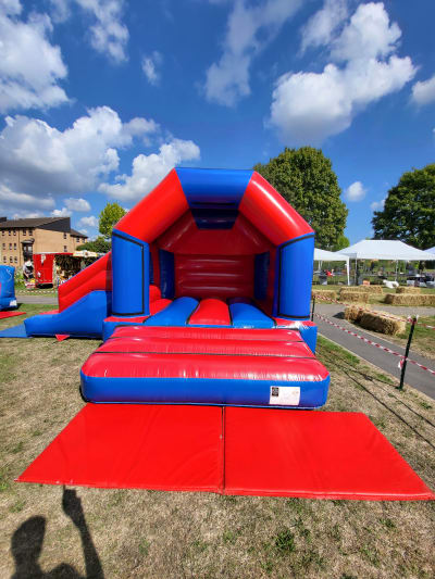 Red & Blue Side Slide Combo, a bounce and slide combo for hire from Kendall's Castles