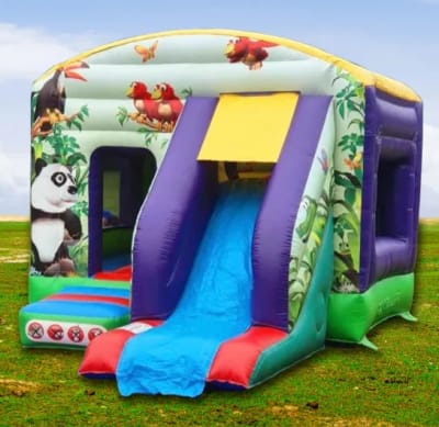 Jungle Front Slide combo Inflatable castle with slide and side netting, a bounce and slide combo for hire from Bounce and Play Surrey & Sussex