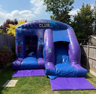Disco Bounce 'n' Slide (12ft x 18ft), a bounce and slide combo for hire from Elmbridge Inflatables