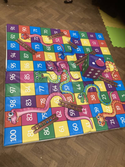 Giant snakes and ladders game, a inflatable game for hire from Wallington Bouncy Castles