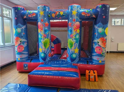 Red & Blue Party Midi Castle INDOORS ONLY (10ft x 13ft), a bouncy castle for hire from Elmbridge Inflatables