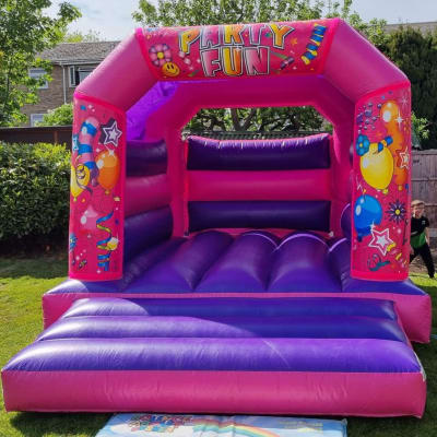 Party Fun Pink Castle, a bouncy castle for hire from Bounce About Sussex