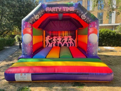 15 x 12 Party themed Bouncy castle ( LARGE ), a bouncy castle for hire from TFG Bouncy Castles