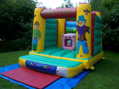 10 x 12 Funny Farm Bouncy Castle, a bouncy castle for hire from Jump & Bounce