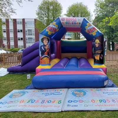Fireman Sam Slide 15ft x 18ft - Purple & Red, a inflatable slide for hire from Happy Hippos Bouncy Castles