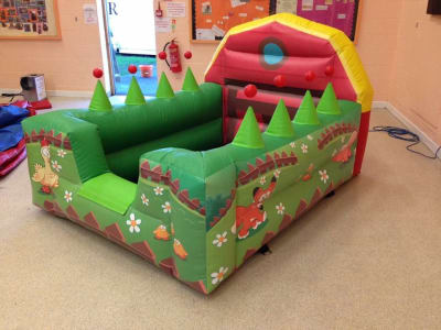 8ft x 6ft Farmyard Air Juggler Ball Pit, a soft play set for hire from Wizard Bouncy Castles