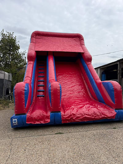 Red and Blue Mega Platform Slide, a inflatable slide for hire from Bounce House Inflatables