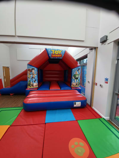 Toy Story Side Slide Combo, a bounce and slide combo for hire from Kendall's Castles