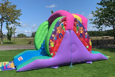 Disco themed Inflatable Slide 11ft High, a inflatable slide for hire from 1st Choice Inflatables