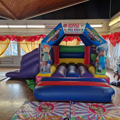 Minecraft Slide 15ft x 18ft - Purple & Red, a inflatable slide for hire from Happy Hippos Bouncy Castles