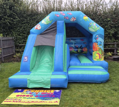 Slide Bouncer Bouncy Castle Seaworld themed with Front Slide, a bounce and slide combo for hire from 1st Choice Inflatables