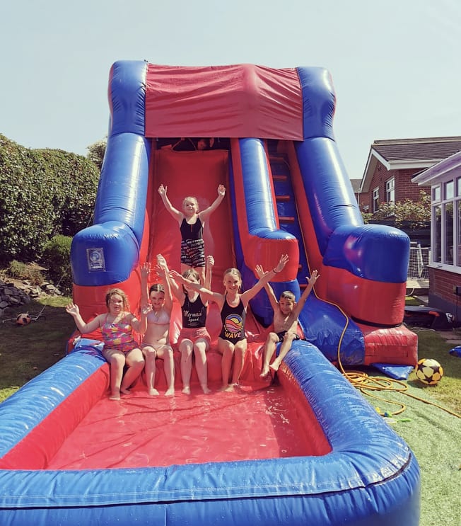 Inflatable water hot sale slide into pool