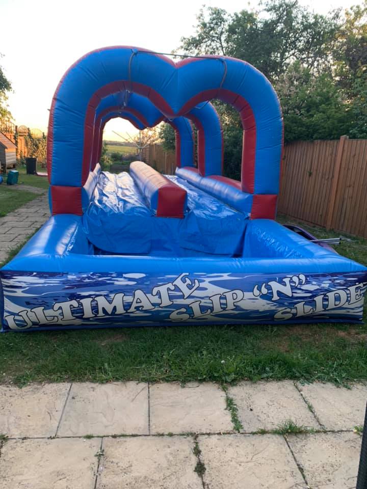 Inflatable slip shop and slide