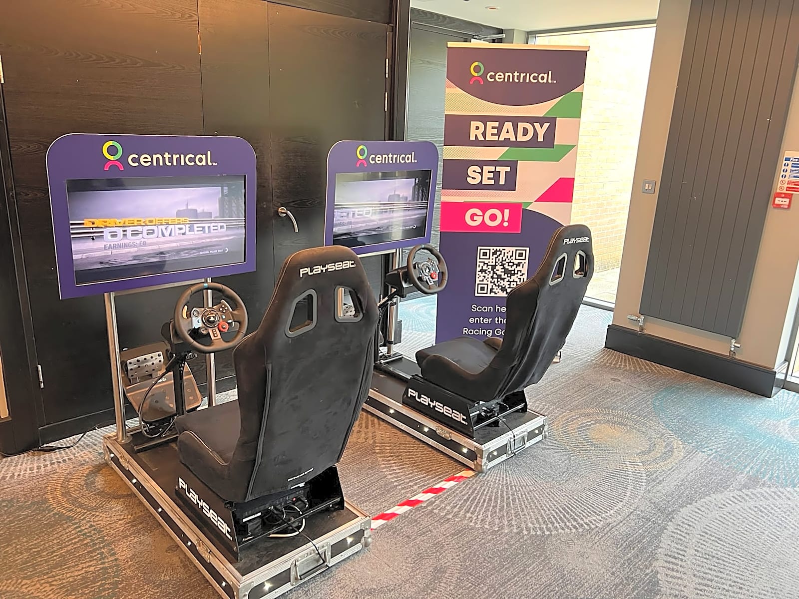 Bespoke branded racing car simulators at a corporate event