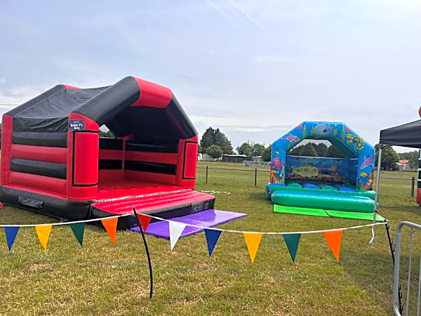 Adult Bouncy Castle Hire - Red and Black With Roof – photo 3