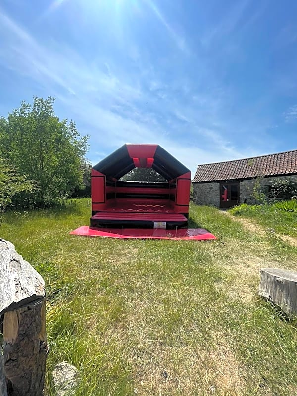 Adult Bouncy Castle Hire - Red and Black With Roof – photo 2