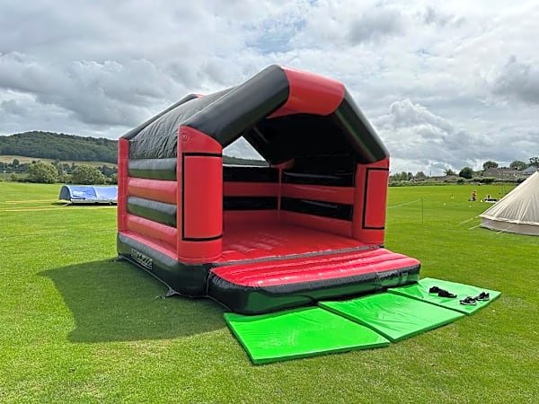 Adult Bouncy Castle Hire - Red and Black With Roof – photo 7